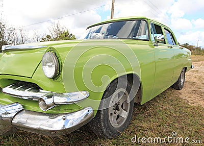 Old green american car closeup