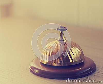 Old hotel bell on a wood stand