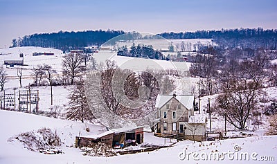 Old house and the snow covered landscape of rural York County, P