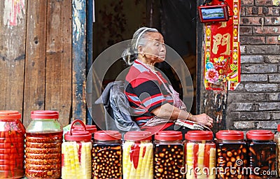 The old lady selling pickles in gaomiao town,sichuan,china