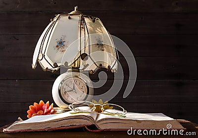 Old Lamp and Books with reading glasses