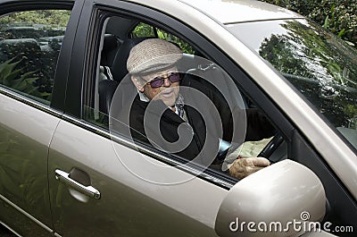 Old man driving a car