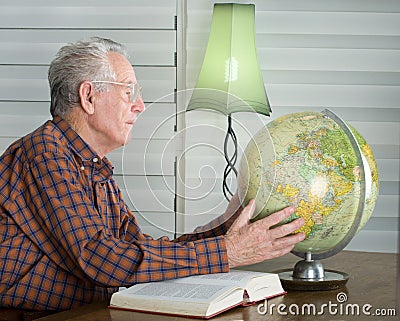 Old man with globe