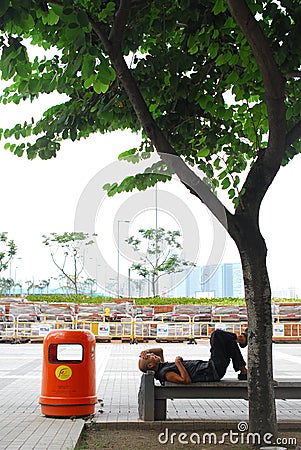 Old man sleeping at street