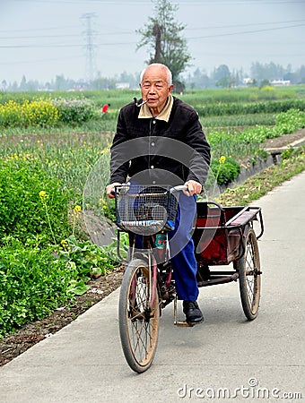 Pengzhou, China: Old Man Riding Bicycle Cart