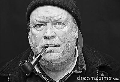 Old man smoking pipe