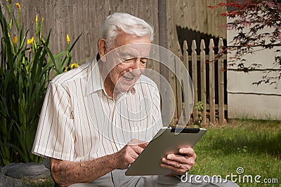 Old man on tablet computer