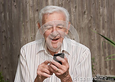 Old man using smart phone