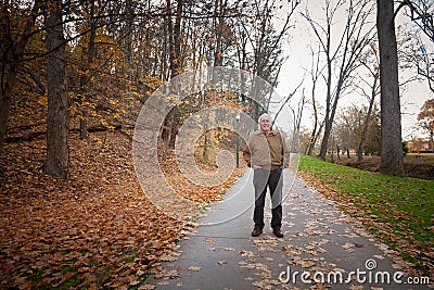 Old Man Walking on a Trail