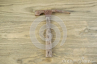Old Masonry hammer on aged wood