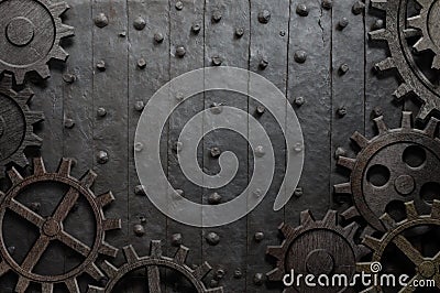 Old metal background with rusty gears and cogs