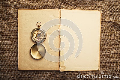 Old open book with compass