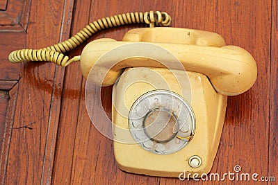 Old phone vintage style on the wooden floor.