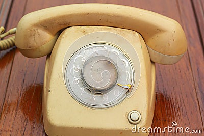 Old phone vintage style on the wooden floor.