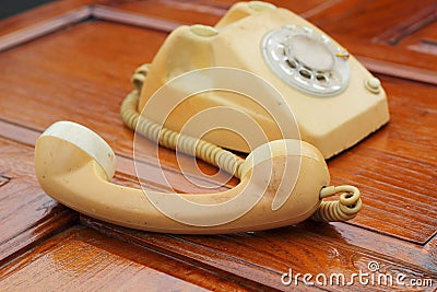 Old phone vintage style on the wooden floor.
