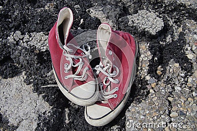 Old Red Canvas Shoes - Asphalt Background
