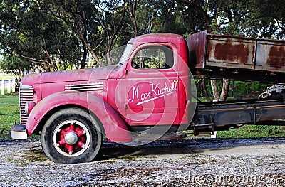 Old red vintage truck at the entrance of Kuchel estate