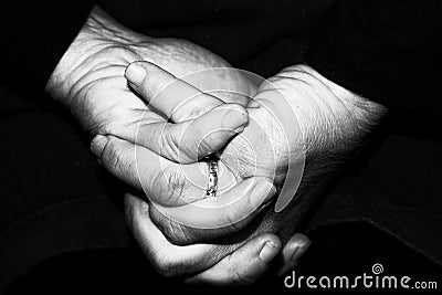 Old retired woman crossed hands