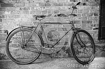 Old retro bicycle against brick wal
