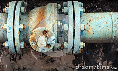 Old rusted valve on industrial pipeline