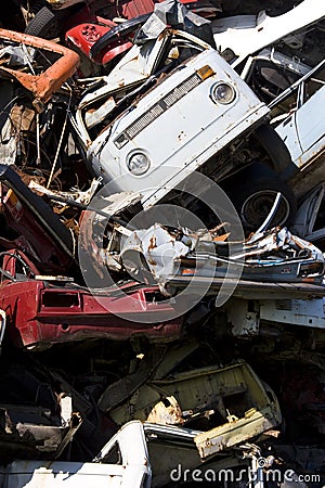 Old rusting cars in a junk yard