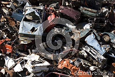Old rusting cars in a junk yard