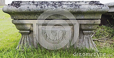 Old stone tomb with engraved text