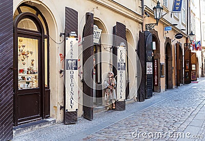 Old street in Prague town with souvenir shops