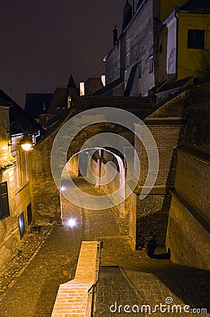 Old town alley and walls at night