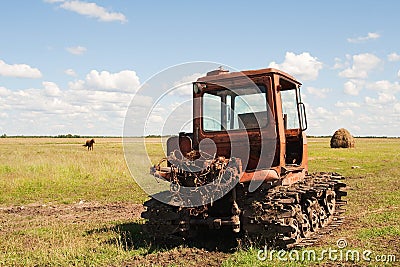 Old tractor on the meadow