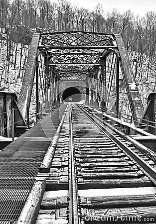 Old train bridge and tunnel in snow