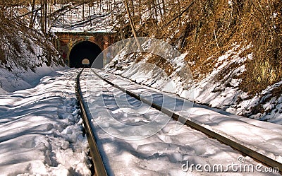 Old train tunnel in snow