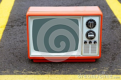 Old TV set on a parking lot