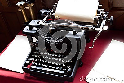 Old typewriter and paper on writers desk