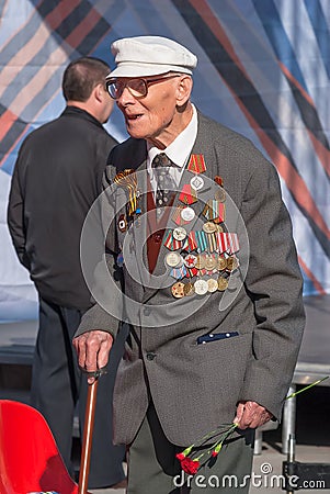 Old veteran of World War II near tribunes