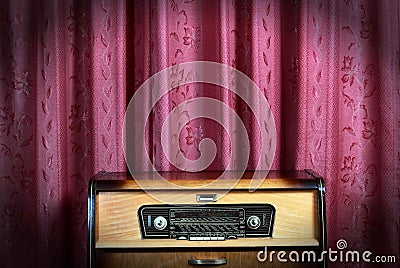 Old vintage radio on red background 2