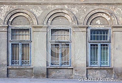 Old window frame on the cracked wall