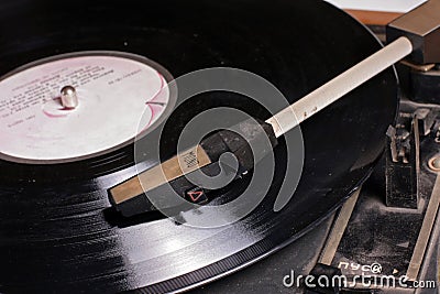 Old wintage gramophone disk player on vinyl disk.