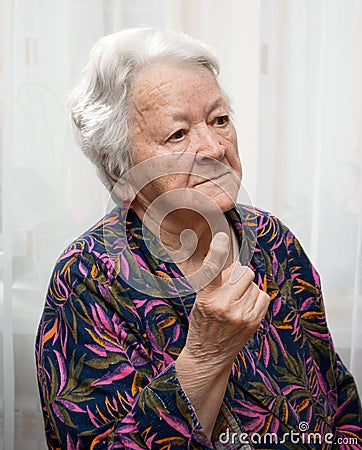 Old woman in angry gesture