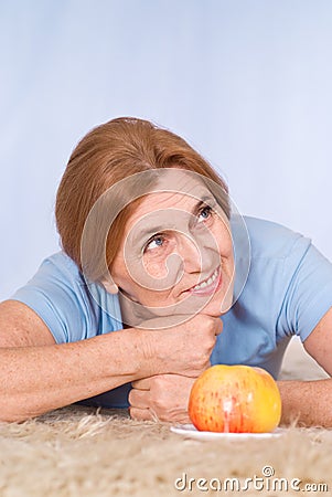 Old woman with apple