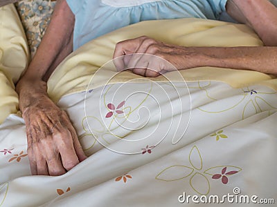 Old woman in a bed
