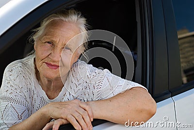 Old woman in the car