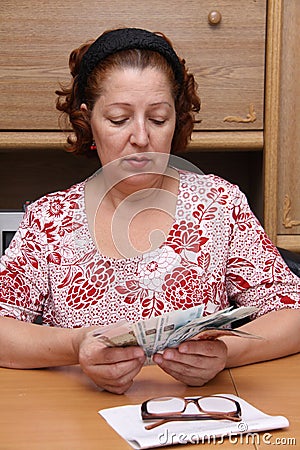 Old woman counts money