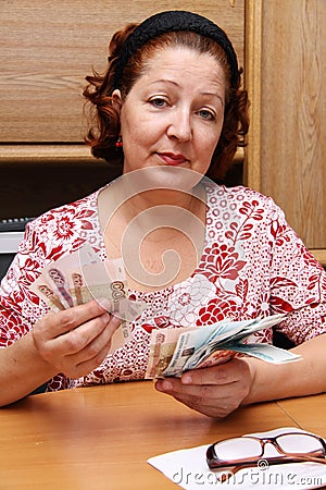 Old woman counts money