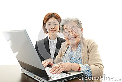 Old woman enjoys laptop computer