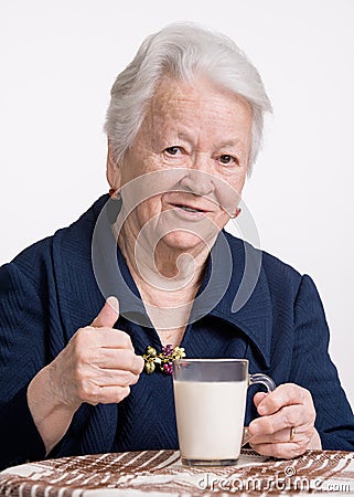 Old woman with glass of milk