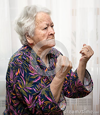 Old woman making fists