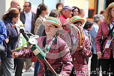 Old woman playing champagne