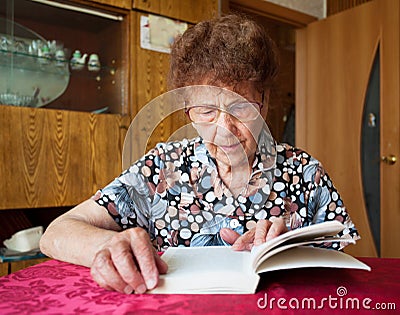 Old woman reading book