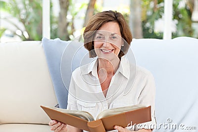 Old woman reading her book